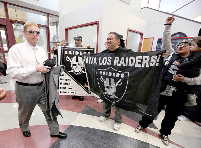 Oakland Raiders fans greet team owner Mark Davis as he arrives at the Stan Fulton Building on the UNLV campus for the Southern Nevada Tourism Infrastructure Committee meeting, Thursday, April 28,  ...