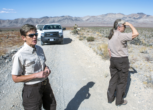 U.S. Fish & Wildlife Service refuge manager Amy Sprunger, left, and project leader Christy Smith views the  Desert National Wildlife Refuge on Friday, Sept. 30, 2016. The Air Force prepares to ...