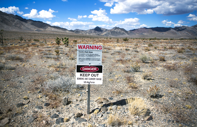 A sign is posted in the Desert National Wildlife Refuge warning travelers not to trespass on the gunnery range is seen, Friday, Sept. 30, 2016. The Air Force prepares to hold public meetings on a  ...