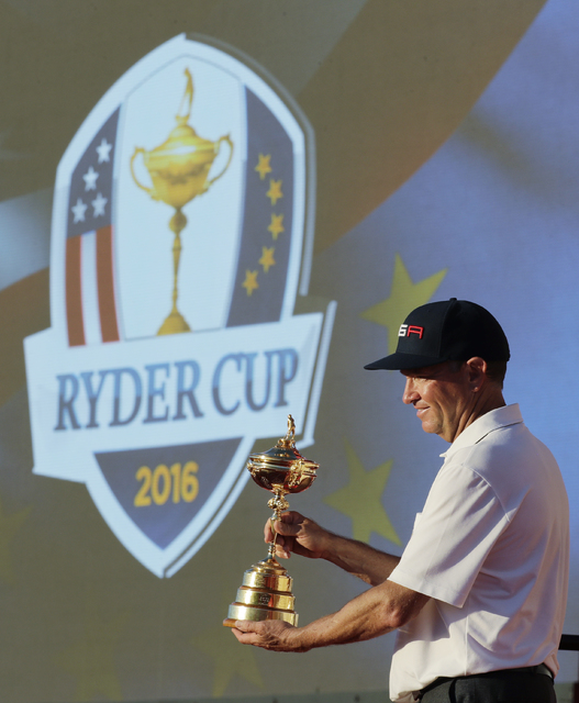 United States captain Davis Love III celebrates during the closing ceremony of the Ryder Cup golf tournament Sunday, Oct. 2, 2016, at Hazeltine National Golf Club in Chaska, Minn. (AP Photo/Charli ...