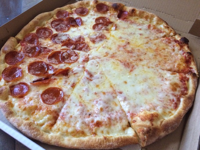 A Sabatino's large Newyopizza is shown with half cheese and half pepperoni. Jan Hogan/View