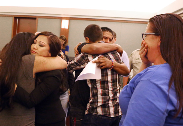 Family members of homicide victim Marcos Arenas, including his father Ivan, center, react after hearing the jury's verdict at the Regional Justice Center on Wednesday, Aug. 31, 2016. Michael Solid ...