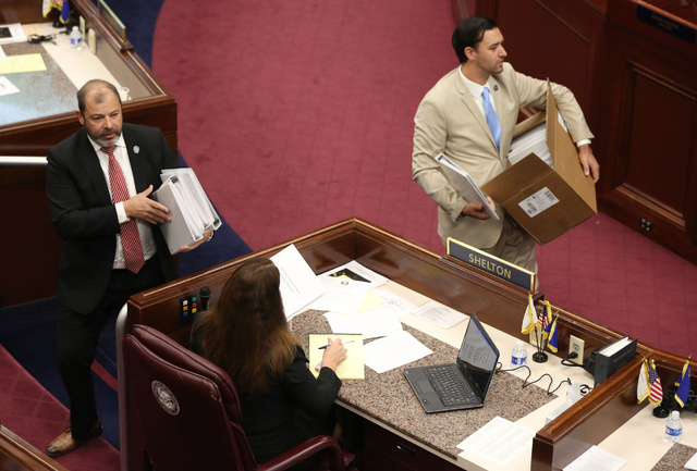 Majority Floor Leader Paul Anderson, left, and Assemblyman Stephen Silberkraus hand out agendas during day one of the 30th Special Session of the Nevada Legislature, Monday, Oct. 10, 2016 in Carso ...