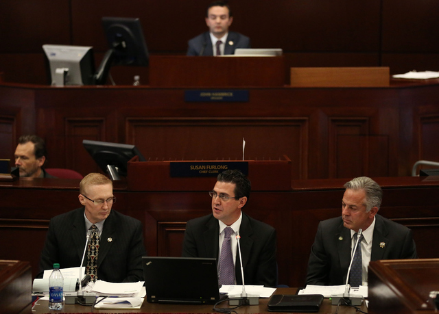 Jeremy Aguero, principle analyst of Applied Analysis, center, speaks during day one of the 30th Special Session of the Nevada Legislature, Monday, Oct. 10, 2016 in Carson City, Nev. (David Guzman/ ...
