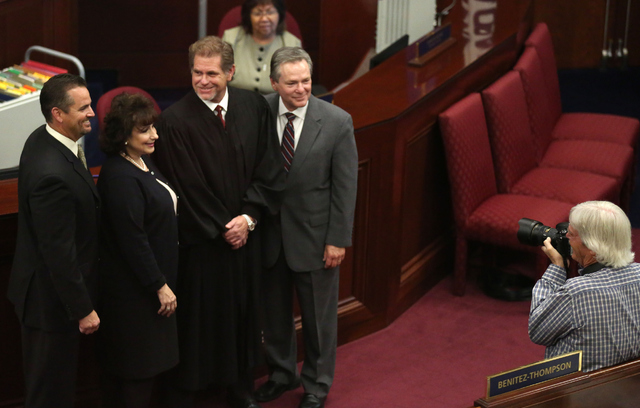 From left, Assemblyman Dominic Brunetti, Assemblywoman Stephanie Smith, Nevada Supreme Court Justice Ron Parraguirre and Assemblyman Kyle James Stephens pose for a photograph during day one of the ...