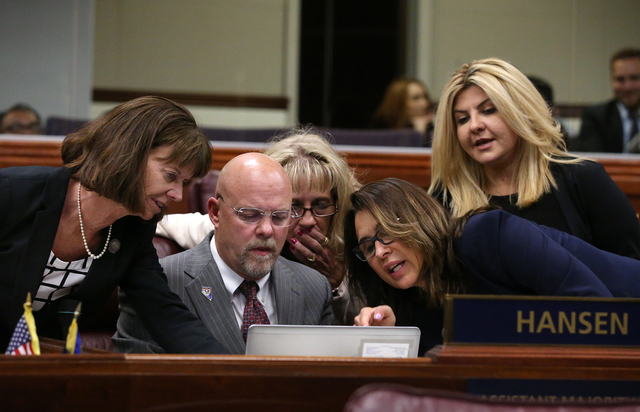 Nevada Assembly Republicans, from left, Robin Titus, Ira Hansen, Jill Dickman, Victoria Seaman and Michele Fiore talk on the Assembly floor during a special session at the Nevada Legislature in Ca ...