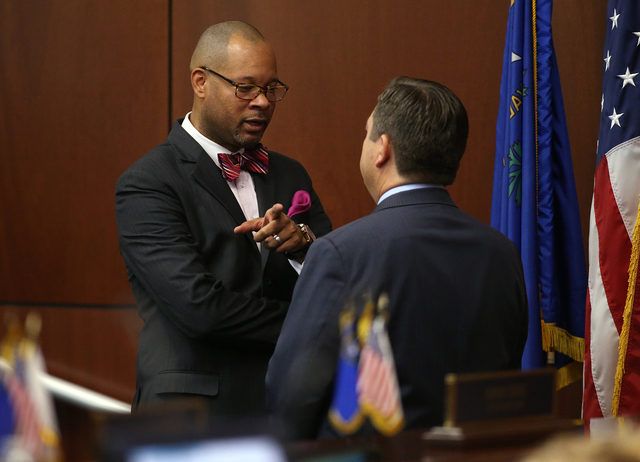Nevada Senate Minority Leader Aaron Ford, D-Las Vegas, left, and Majority Leader Michael Roberson, R-Henderson, talk during a special session at the Legislative Building in Carson City, Nev. on Th ...