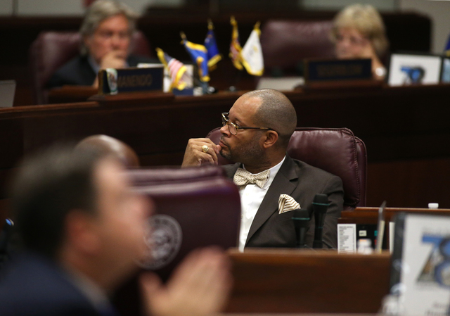 Nevada Senate Minority Leader Aaron Ford, D-Las Vegas, listens to debate on the Senate floor on a proposal to help fund a football stadium and convention center improvements in Las Vegas during a  ...