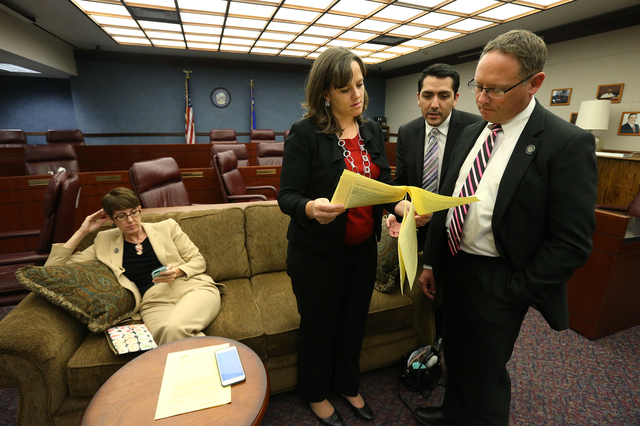Assembly Democrats, from left, Heidi Swank, Amber Joiner, Nelson Araujo and Mike Sprinkle work in a caucus room at the Nevada Legislature in Carson City, Nev. on Tuesday, Oct. 11, 2016. Lawmakers  ...