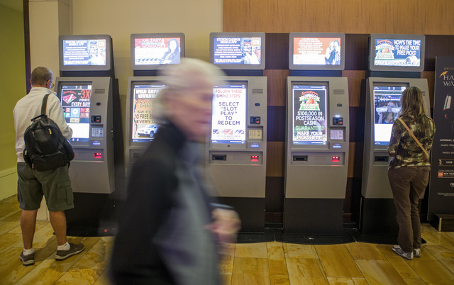 People use the Boarding Pass kiosks, Tuesday, Oct. 25, 2016, at Red Rock Resort. Beginning Nov. 1, Station Casinos will offer points for gaming, dining, spa and hotel spent at its properties. Jeff ...