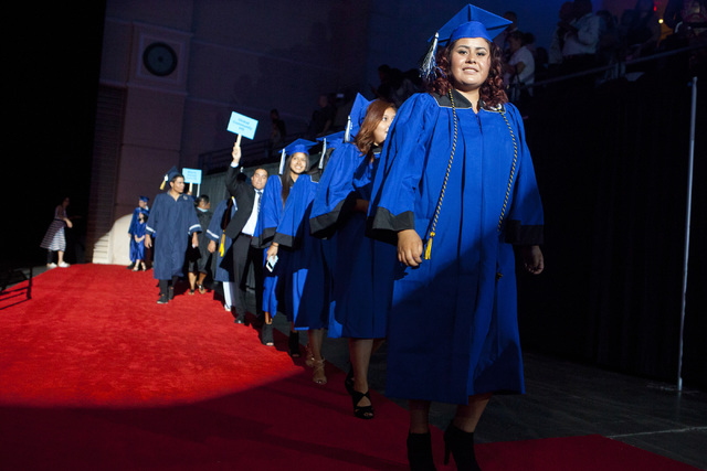 Desert Pines High School graduates walk towards their seats during the Clark County School District's fifth annual summer graduation ceremony on Tuesday, Aug. 23, 2016, at the Orleans Arena in Las ...