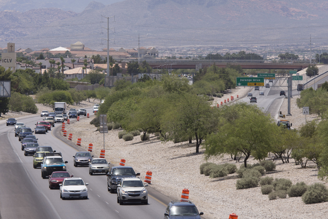 Traffic moves along Summerlin Parkway west of Buffalo Drive as construction takes place for a cable barrier rail system in Las Vegas June 7. View file photo