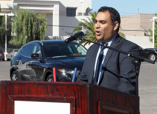 Nasif Siddiqi, Masarati regional vice president, talks about the new Ferrari/Masarati dealership at Towbin Motorcars on Sahara Avenue in Las Vegas, Tuesday, Oct. 18, 2016. Behind him is a Masarati ...