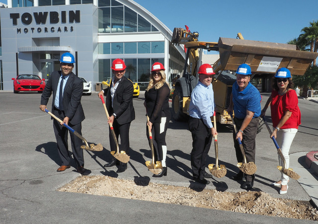 Nasif Siddiqi, Rony Mansour, Jesika Towbin-Mansour, Derrick Williams, Boyd Martin and Carolyn Towbin, left to right, take part in the groundbreaking at the new Ferrari/Masarati dealership at Towbi ...