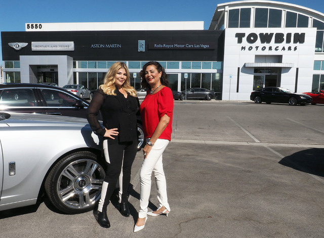 Jesika Towbin-Mansour, left, and her mother, Carolynn Towbin, pose next to a Rolls-Royce at Towbin Motorcars on Sahara Avenue in Las Vegas, Tuesday, Oct. 18, 2016.  (Jerry Henkel/Las Vegas Review- ...