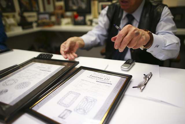 Jeweler Jack Weinstein, who opened Tower of Jewels in 1964, shows diamond patents during an interview ahead of his slated retirement at the store in Las Vegas on Thursday, Oct. 13, 2016. (Chase St ...