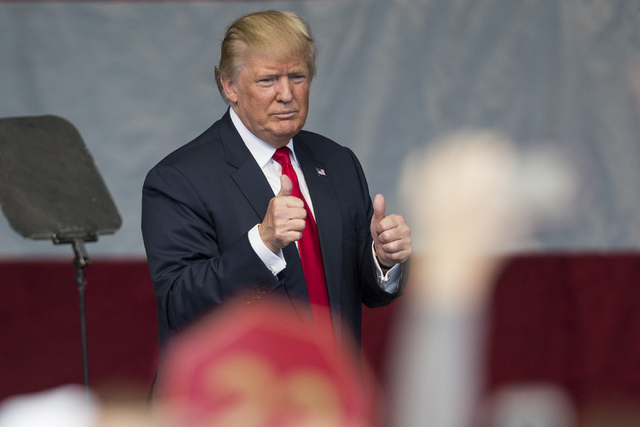 Republican presidential nominee Donald Trump gives supporters two thumbs up following his speech during a campaign rally at the Henderson Pavilion on Wednesday, Oct. 5, 2016, in Henderson, Nev. Er ...