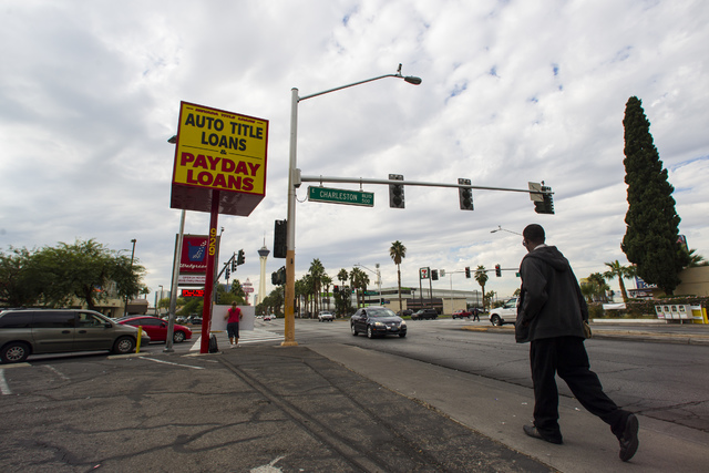 A man passes by Nevada Title Loans off Las Vegas and Charleston boulevards in downtown Las Vegas on Friday, Oct. 28, 2016. Chase Stevens/Las Vegas Review-Journal Follow @csstevensphoto