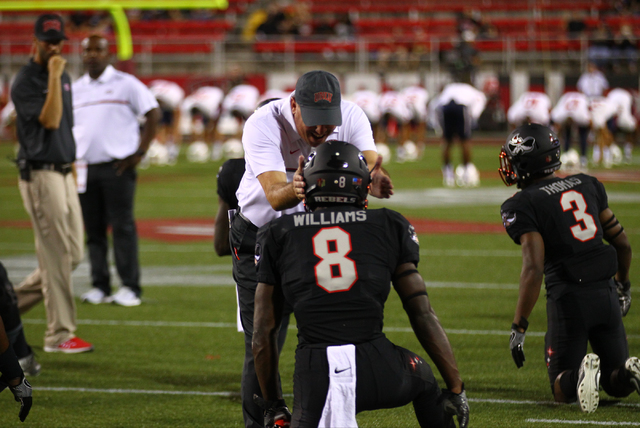 UNLV head coach Tony Sanchez talks with UNLV running back Charles Williams (8) before a football game against Fresno State at Sam Boyd Stadium in Las Vegas on Saturday, Oct. 1, 2016. Chase Stevens ...