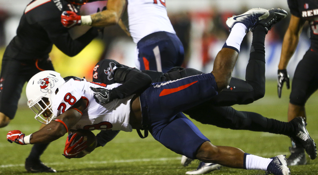 Fresno State running back Dontel James (28) is tackled by UNLV defensive back Kenny Keys (44) during a football game at Sam Boyd Stadium in Las Vegas on Saturday, Oct. 1, 2016. Chase Stevens/Las V ...