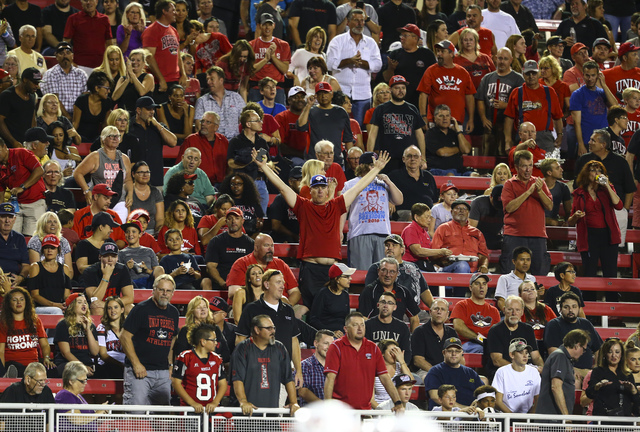 UNLV fans cheer as the team approaches the end zone during a football game against Fresno State at Sam Boyd Stadium in Las Vegas on Saturday, Oct. 1, 2016. Chase Stevens/Las Vegas Review-Journal F ...