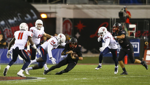 Fresno State linebacker Jeffrey Allison (24) closes in on UNLV quarterback Dalton Sneed (18) during a football game at Sam Boyd Stadium in Las Vegas on Saturday, Oct. 1, 2016. Chase Stevens/Las Ve ...