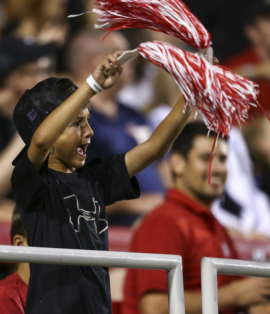 A young fan cheers after a touchdown by UNLV quarterback Dalton Sneed (18) against Fresno State during a football game at Sam Boyd Stadium in Las Vegas on Saturday, Oct. 1, 2016. Chase Stevens/Las ...