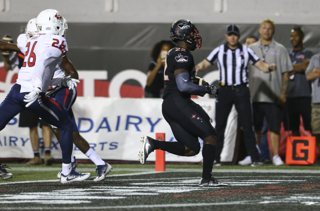 UNLV running back David Greene (22) scores a touchdown against Fresno State during a football game at Sam Boyd Stadium in Las Vegas on Saturday, Oct. 1, 2016. UNLV won 45-20 against Fresno State.  ...