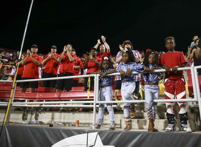 Fans watch as UNLV players celebrate after defeating Fresno State in a football game at Sam Boyd Stadium in Las Vegas on Saturday, Oct. 1, 2016. UNLV won 45-20 against Fresno State. Chase Stevens/ ...