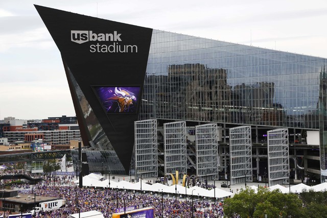Fans arrive at U.S. Bank Stadium before an NFL football game between the Minnesota Vikings and the Green Bay Packers Sunday, Sept. 18, 2016, in Minneapolis. (AP Photo/Andy Clayton-King)