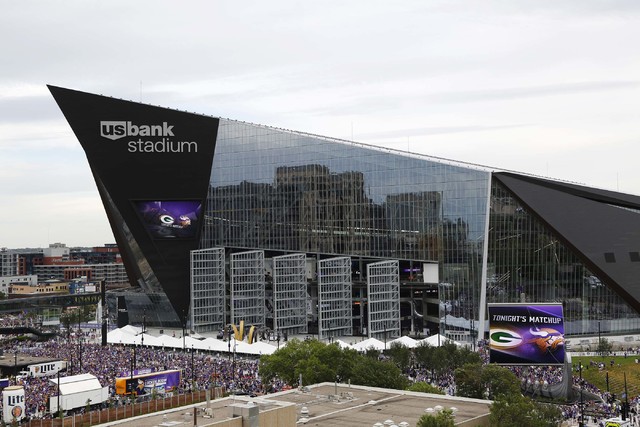 Fans arrive at U.S. Bank Stadium before an NFL football game between the Minnesota Vikings and the Green Bay Packers Sunday, Sept. 18, 2016, in Minneapolis. (AP Photo/Andy Clayton-King)