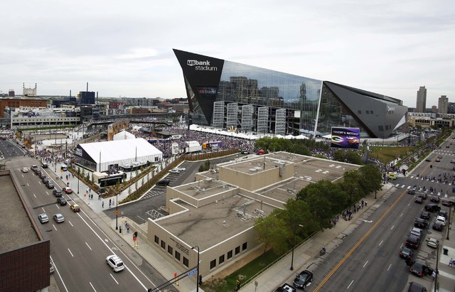 Fans arrive at U.S. Bank Stadium before an NFL football game between the Minnesota Vikings and the Green Bay Packers Sunday, Sept. 18, 2016, in Minneapolis. (AP Photo/Andy Clayton-King)