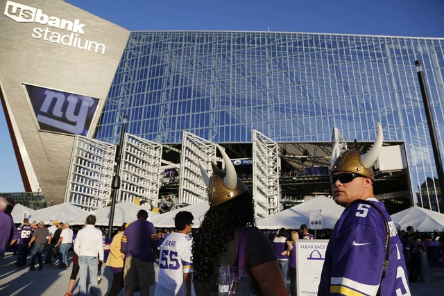 Fans arrive at U.S. Bank Stadium before an NFL football game between the Minnesota Vikings and the New York Giants Monday, Oct. 3, 2016, in Minneapolis. (AP Photo/Andy Clayton-King)