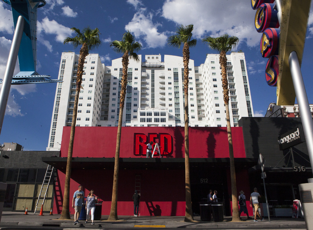 Construction workers are seen working on the outside of Red video bar which took over the space Insert Coin(s) once occupied in downtown Las Vegas, Thursday Sept. 1, 2016. (Miranda Alam/Las Vegas  ...