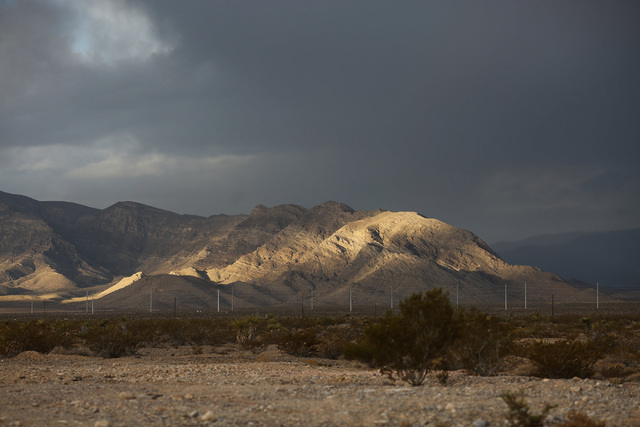 A break in the clouds allows a swath of light to accent a ridge on the the west side of Las Vegas Valley on Friday, Oct. 28, 2016. (Brett Le Blanc/Las Vegas Review-Journal Follow @bleblancphoto)