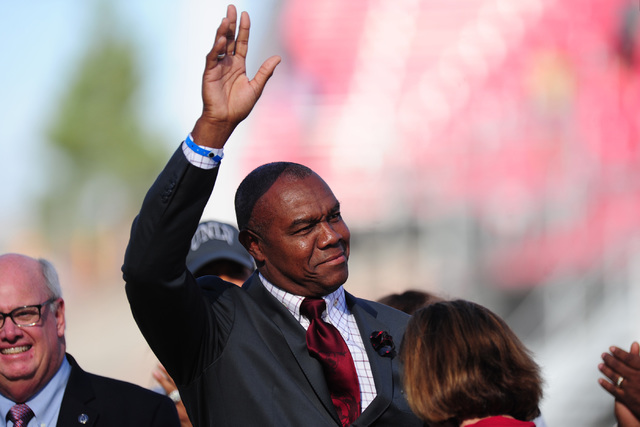 Former UNLV Rebels quarterback Randall Cunningham is honored with a plaque from the College Football Hall of Fame their NCCA college football game against the Colorado State Rams at Sam Boyd Stadi ...