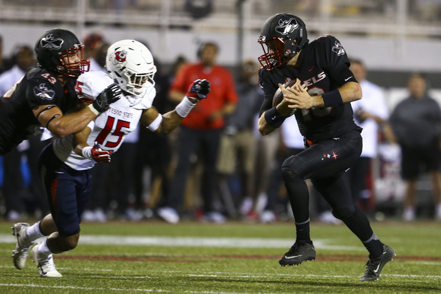 Fresno State defensive back Stratton Brown (15) chases after UNLV quarterback Dalton Sneed (18) during a football game at Sam Boyd Stadium in Las Vegas on Saturday, Oct. 1, 2016. Chase Stevens/Las ...