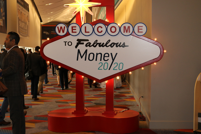 Money 20/20 attendees file into the convention center behind the Vegas-themed welcome sign at the Venetian Tuesday Oct. 25, 2016. (Nicole Raz/Las Vegas Review-Journal)