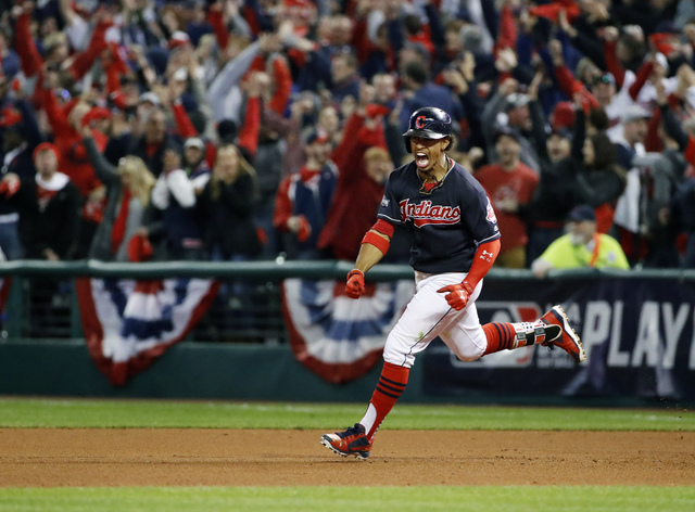 FILE - In this Friday, Oct. 14, 2016, file photo, Cleveland Indians' Francisco Lindor rounds the bases on his two-run home run against the Toronto Blue Jays during the sixth inning in Game 1 of ba ...
