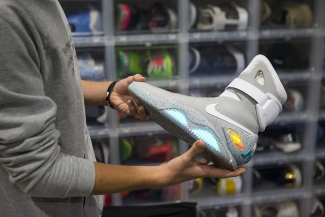Sixteen-year-old Blake Wynn holds his Nike Mag &quot;'Back to the Future&quot; shoes while talking about collecting and reselling sneakers at his home in the Summerlin area of Las Vegas on ...