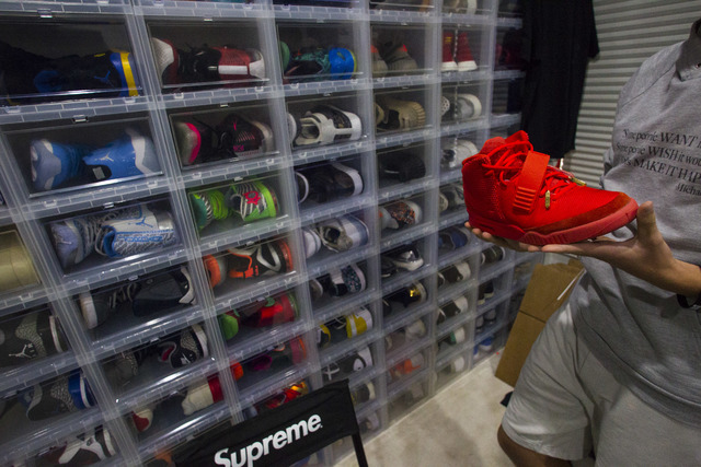 Sixteen-year-old Blake Wynn holds his Nike Air Yeezy 2 Red October shoes while talking about collecting and reselling sneakers at his home in the Summerlin area of Las Vegas on Wednesday, Oct. 5,  ...