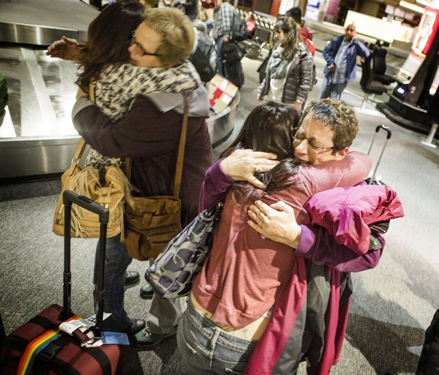 Nancy, left, Kathy, Jaclyn and Debby, declined to give last name, hug in Baggage Claim at McCarran International Airport on Wednesday, Nov. 25, 2015. Jaclyn and Nancy are traveling from San Jose   ...