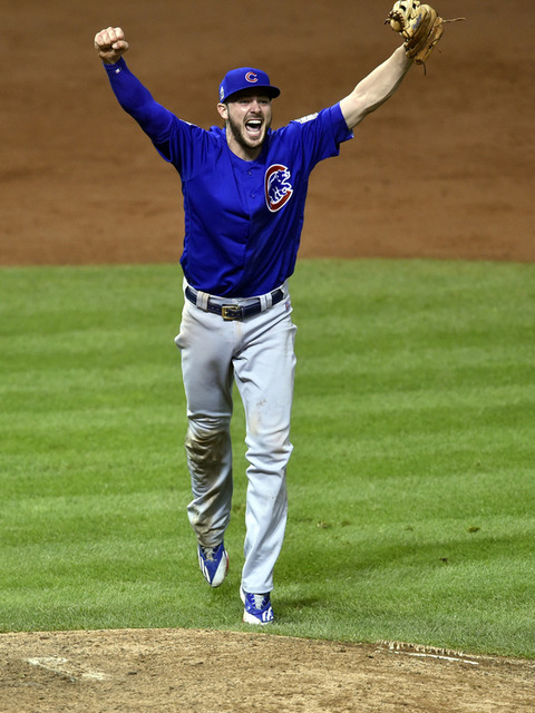 Chicago Cubs Kris Bryant falls throws to first for the final out over the  Cleveland Indians during the tenth inning of World Series game 7 at  Progressive Field in Cleveland, Ohio, on