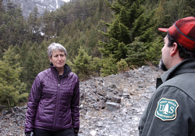 US Interior Secretary Sally Jewell, left, listens to a Forest Service official talk about the impacts of mining in the Absaroka Mountains near Pray, Mont., Monday, Nov.21, 2016. Jewell on Monday ...