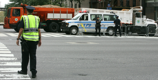 FILE- In this Sept. 22, 2009 file photo, a sanitation truck loaded with sand is used to block 42nd Street for increased security, one block from the United Nations as world leaders meet for the U. ...