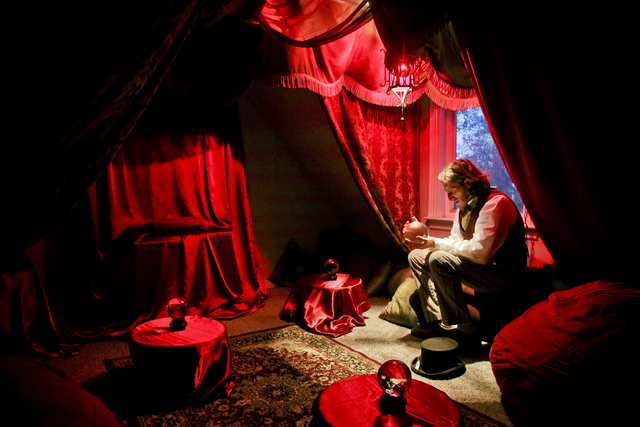 In a Saturday, Nov. 19, 2016 photo, Benjamin Lee-Roche sits in the divination room of his academy of magical arts at his home in Springville. The Blackburn Academy of the magical arts was built by ...