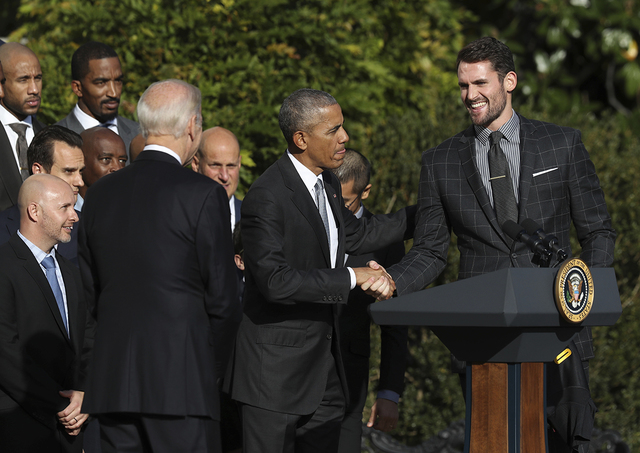 President Barack Obama congratulates Cleveland Cavaliers' forward Kevin Love during a ceremony on the South Lawn of the White House in Washington, Thursday, Nov. 10, 2016, where the president hono ...