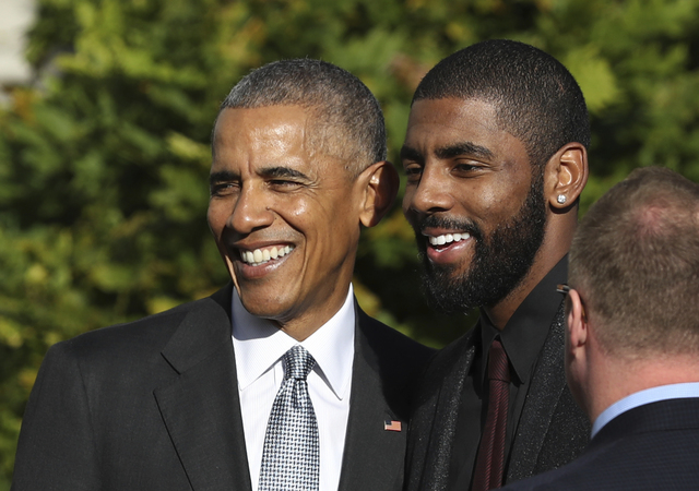 President Barack Obama poses for a picture with Cleveland Cavaliers point guard Kyrie Irving during a ceremony on the South Lawn of the White House in Washington, Thursday, Nov. 10, 2016, where th ...