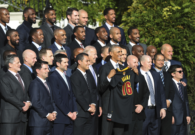 President Barack Obama poses for a team picture with the Cleveland Cavaliers during a ceremony honoring the 2016 NBA Champion on the South Lawn of the White House in Washington, Thursday, Nov. 10, ...