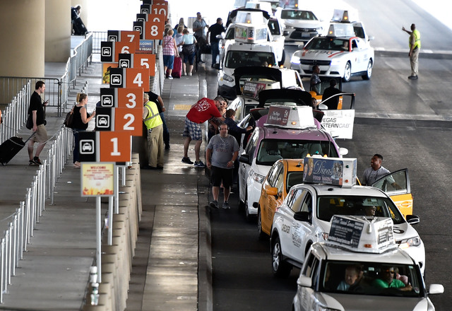 Taxi cabs line up for their passengers at Terminal 3 at McCarran International Airport Wednesday, Sept. 21, 2016, in Las Vegas. (David Becker/Las Vegas Review-Journal) Follow @davidjaybecker